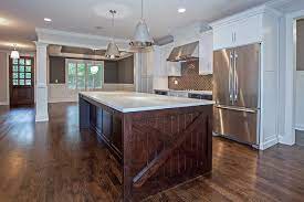 Brown kitchen cabinets with white island. White Cabinets With Dark Brown Island Transitional Kitchen