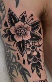 Poppy flowers tattoo on left back shoulder. American Traditional Flower Tattoos A Visual Guide