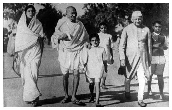 1944: Mahatma Gandhi with his son Devdas at the Juhu Beach, Mumbai.