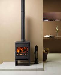 A scandinavian wood stove heats a modern space with an open floorplan. 10 Easy Pieces Freestanding Wood Stoves