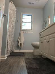 Modern farmhouse bathroom makeover with painted floor. My Finished Bathroom Traffic Master Allure Plus 5 Vinyl Plank In Gray Maple For The Floor Vinyl Flooring Bathroom Bathroom Vinyl Bathroom Design