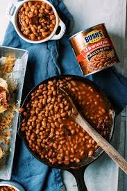 Named for the arizona's famed desert, this is a beef frank wrapped in bacon, then cooked on a griddle and piled with pinto beans, grilled onions, chopped tomatoes, mayonnaise or. Cowboy Dogs With Bush S Homestyle Baked Beans Dad With A Pan