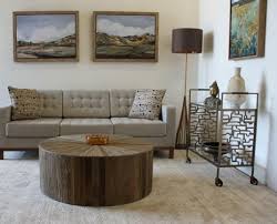 The modern round cyrano coffee table by gabby is inlaid with pie wedges of recycled reclaimed elm wood in different shades of natural wood. Cyrano Coffee Table