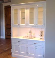 The diy plans to build a tall cabinet hutch fit on top of the tall cabinet base and feature the same type of doors (with glass or plexiglas panels) with a shelf inside. Hutch Designs Ideas