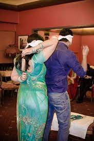 Couple Party Games Wearing Bangles Is Not Easy Always Couple Party Games Dinner Party Games Anniversary Party Games