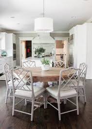 Refurbished solid pine farmhouse style dining table and eight ladderback chairs painted in farrow and ball 'strong white' with several coats. The Beauty Of Round Dining Tables And Some Fun Entertainment Classic Casual Home Transitional Dining Room Modern Farmhouse Dining Room Farmhouse Dining Room Table