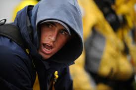 U.S. Coast Guard First Class Daniel Piazza shouts while pulling in line  Monday, July 4, 2011, aboard the Coast Guard Cutter Eagle in the Atlantic  Ocean south of Greenland. Piazza is one