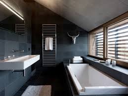 A small elegant attic bathroom with white subway tiles, a black clad bathtub and vanity, a white tub and a large attic bathroom in neutrals and light blue with a large skylight and a double vanity (dyer. Efficient Use Of Your Attic 18 Sleek Attic Bathroom Design Ideas