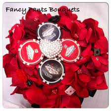 View our stunning collection of bouquets, bridal wands creatively styled bouquets made from brooches, fine jewellery, and lace, through to seashells, crystals and feathers. Casino Theme Bouquet Las Vegas Bouquet By Fancy Pants Bouquets Bouquets Brides Las Vegas Brooch Bouquet 10 Vegas Wedding Bouquet Fancy Pants Vegas Wedding