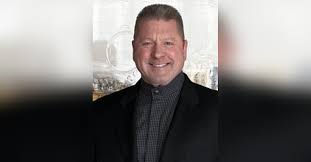 John E. Adams Obituary