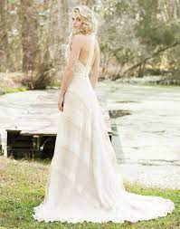 Crocheted Lace Creates A Geometric Pattern On This Halter Racerback A Line Gown With A Bea Racerback Wedding Dress Lillian West Wedding Dress Wedding Dresses