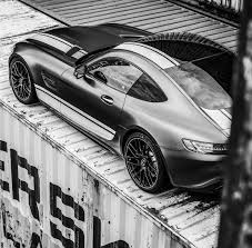 The Sleek Lines And Alluring Curves Of The Mercedes Amg Gt S Stand Out Among The Industrial Metal Work Of This Container Cit Mercedes Amg Gt S Mercedes Amg Car