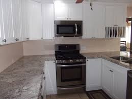 small kitchen cupboards with cherry