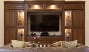 With the doors closed the tv does not impose on the space or interrupt the activity within it. Custom Entertainment Centers Arizona Floating Entertainment Centers