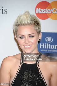 414 Miley Cyrus And Clive Davis Pre Grammy Stock Photos, High-Res Pictures,  and Images