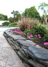 Building a stone wall with fieldstone. How To Build A Fieldstone Garden Wall Slate Garden Diy Fieldstone Garden Edging