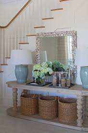 The wall behind your console table is the perfect space to draw attention to your arrangement. Oval Console Table Cottage Entrance Foyer Urban Grace Interiors