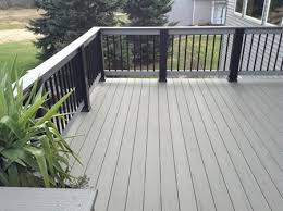 a composite wood deck with a light grey color and a nice railing deck design deck makeover house deck