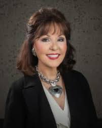 Janet O. Vackar, "Vice-Chairwoman of the Board and President of Marketing" 