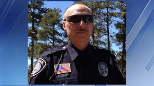 Phoenix — a man suspected of killing a police officer in eastern arizona was killed early wednesday morning after a hostage standoff with law enforcement. Police Officer Darrin Lee Reed Show Low Police Department Arizona