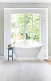 The master bedroom features a private balcony with cable railing and dreamy views of the lake. Lake House Master Bathroom The Lilypad Cottage