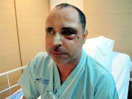 Two Russians charged over beach assault; search