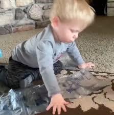 Little Boy Shows How To Properly Pop Bubble Wrap
