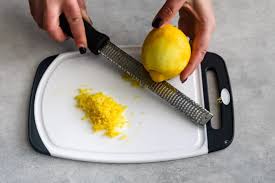 Simply hold the zester steady and slide the lemon down over the shape textured side. Learn How To Zest A Lemon Easily Crazy For Crust