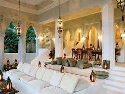 Here are five ways to bring an arabian essence to your house while you might choose to have a dining table, incorporating some comfy and brightly colored floor cushions into your home can be fun and functional. Middle Eastern Style Living Room Moroccan Interiors Moroccan Living Room House Design