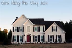 Looking for a exterior house colour scheme that not only looks fabulous but won't go out of date in a hurry? Before And After House Exterior Paint Job Light Gray Paint Black Shutters Black Roof And Red Front Door