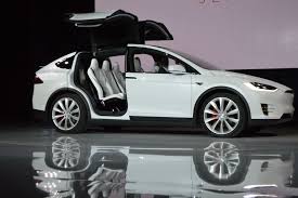 Tesla owner demands $1million after model x doors 'wouldn't open' as the car crashes and bursts she and her boyfriend were sitting in the back and tried to open the car's doors but she claims the doors were jammed, forcing them to escape through the front An Evening Up Close With The Tesla Model X Ars Technica