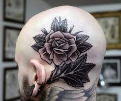 Traditional rose tattoo black and grey. Grey Rose With Black Leaves Tattoo On Man Head