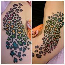 When getting an animal print tattoo, have a clear idea as to what the spots look like. A Bold Statement Bright Colors In This Cheetah Print Tattoo Leopard Tattoos Cheetah Print Tattoos Leopard Print Tattoos