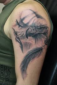 15 Best Eagle Feather Tattoo Designs And Ideas Petpress In 2020 Eagle Feather Tattoos Eagle Tattoo Eagle Tattoos