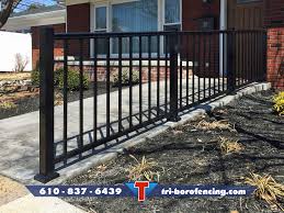 The square has four small holes to drive concrete screws through with a hammer drill. Black Aluminum Railing Installed On A Concrete Ramp Fence Styles Aluminum Fence Aluminum Railing