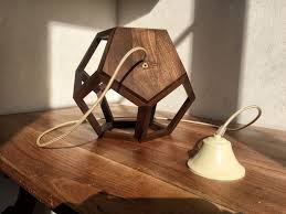 While a lot of artists in the 21st century move towards the digital medium, yelena filipchuk & serge beaulieu quit their tech jobs to make real world objects. Lighting Pendant Light Dodecahedron Table Lamp Albiorix Wooden Lamp Chandeliers Pendant Lights