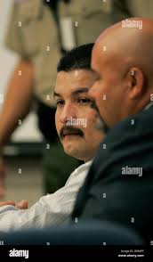 Published 10/18/05, B-1) VISTA, CA 10/17/05- ADRIAN CAMACHO sits with  WILLIAM STONE, one of his two lawyers, during this morning's opening  arguments
