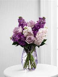 Daisies, alstroemeria, lilies and chrysanthemum poms are commonly used for floral arrangements. Purple Flowers And Pink Flowers Arranged In A Purple Vase Including Purple Roses Flower Arrangements Purple Flower Arrangements Purple Flowers