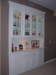 Painting this dining room china cabinet the same color as the french doors, and door frames, makes the room feel bigger. Pin On Indoor Decor And More