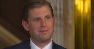 Arab-American comedian Mo Amer sits next to Eric Trump