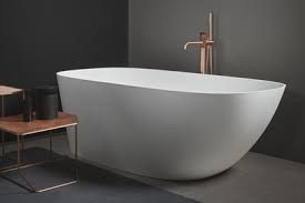 A slotted overflow drain allows full immersion for a deep, restful bath. Ceric By Kohler Architect Magazine