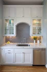 Mary jo fiorella if you've decided that subway tile is the right style for your kitchen backsplash, your first task will be to determine exactly what tile material you want to feature. Small Kitchen Gray Subway Tile Backsplash Grey Subway Tiles Backsplash Tile Design