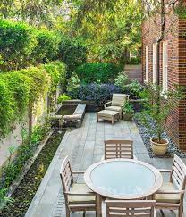 The backdrop of green shrubbery forms a warming border between the cold brick and your luscious sitting area. 9 Stylish Side Yard Seating Areas