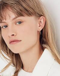 The most popular gold on the market is 14kt gold (was there really any question?) what that means, is that 14 parts are gold , and 10 parts are other alloys mixed with it. Women S 14k Gold Filled Hoop Earrings Madewell