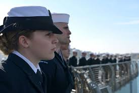 Interior Communications Electrician 3rd Class Suzanne Drew mans-the-rails  of the Blue Ridge-class command ship USS Mount Whitney (LCC 20) as the ship  arrives in its forward-deployed port of Gaeta, Italy