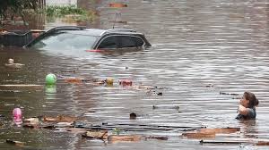 A car stands in a flooded street on july 14, 2021 in hagen, western germany, after heavy rain hit parts of the country, causing widespread flooding. Hr8dcahr2bnqhm