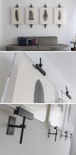 Wall Art Display Ideas These Contemporary Industrial Metal Clamps Are An Alternative Way To Display A Collection Unique Wall Decor Decor Interior Design Industrial Wall Art