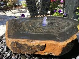 White marble standing stone thats been drilled to make water features. Water Features Tor Stone Ltd