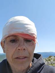 Man running down mountain in shorts