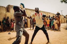 Boxing is a combat sport in which two people, usually wearing protective gloves and other protective equipment such as hand wraps and mouthguards, throw punches at each other for a predetermined amount of time in a boxing ring. How Peace Direct Combats Boko Haram In Northern Nigeria Here Magazine Away